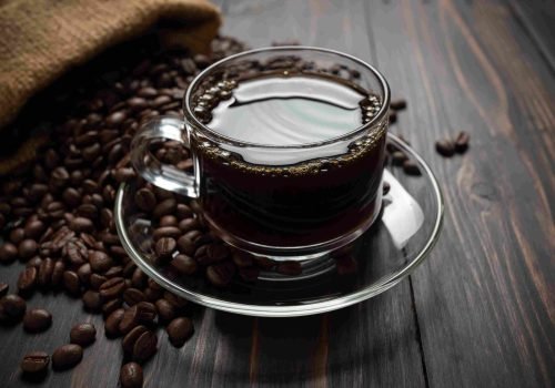 hot-coffee-glass-wooden-table_4_11zon